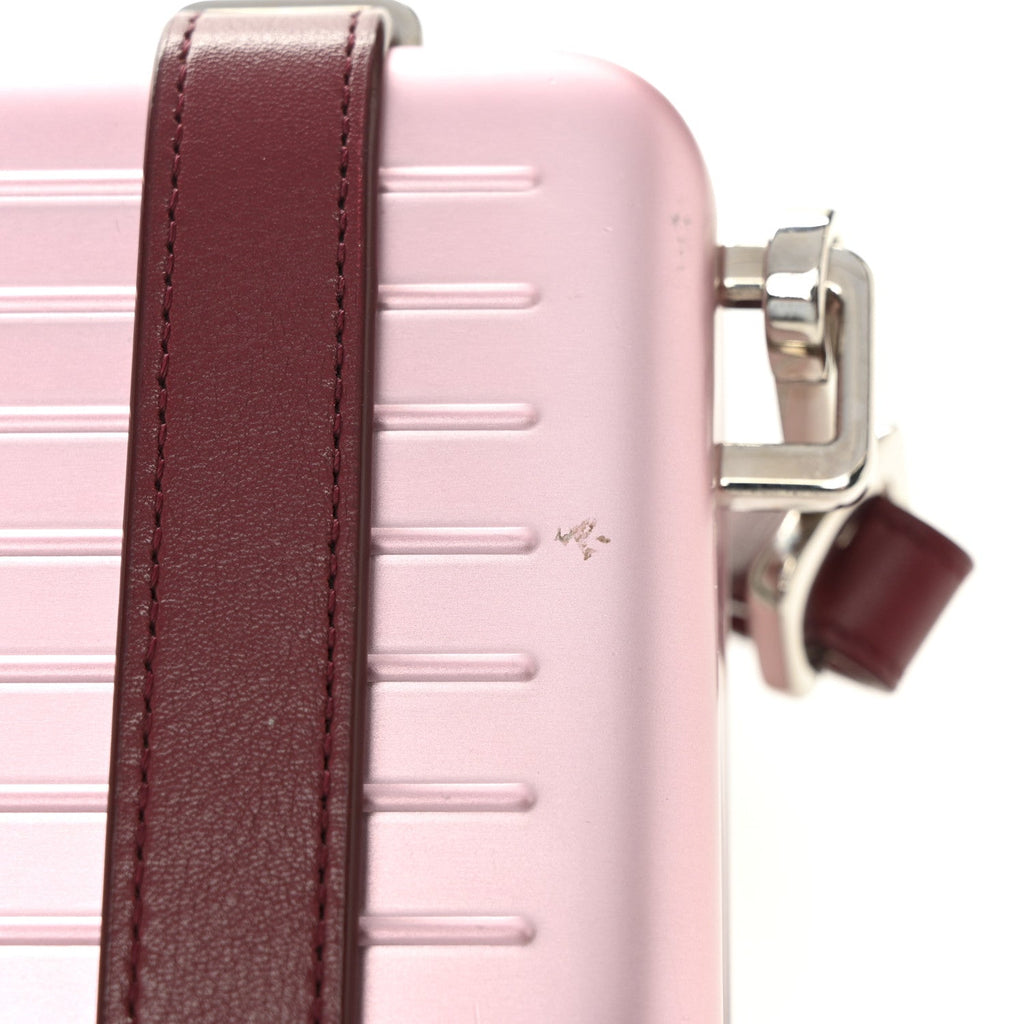 X RIMOWA ALUMINUM PERSONAL CLUTCH ON STRAP ROSE