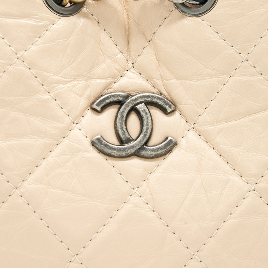 CHANEL GABRIELLE BACKPACK IN AGED CALFSKIN QUILTED LEATHER BEIGE