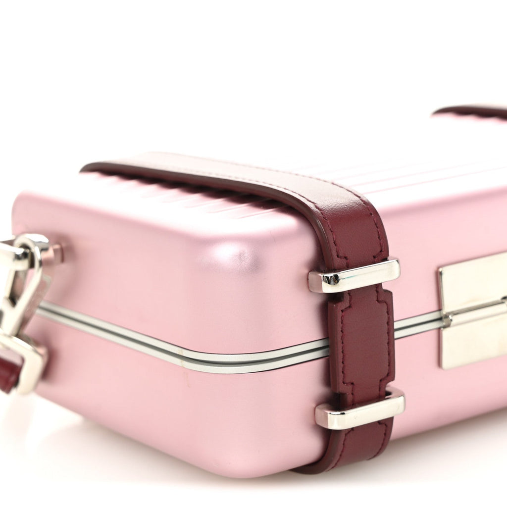 X RIMOWA ALUMINUM PERSONAL CLUTCH ON STRAP ROSE